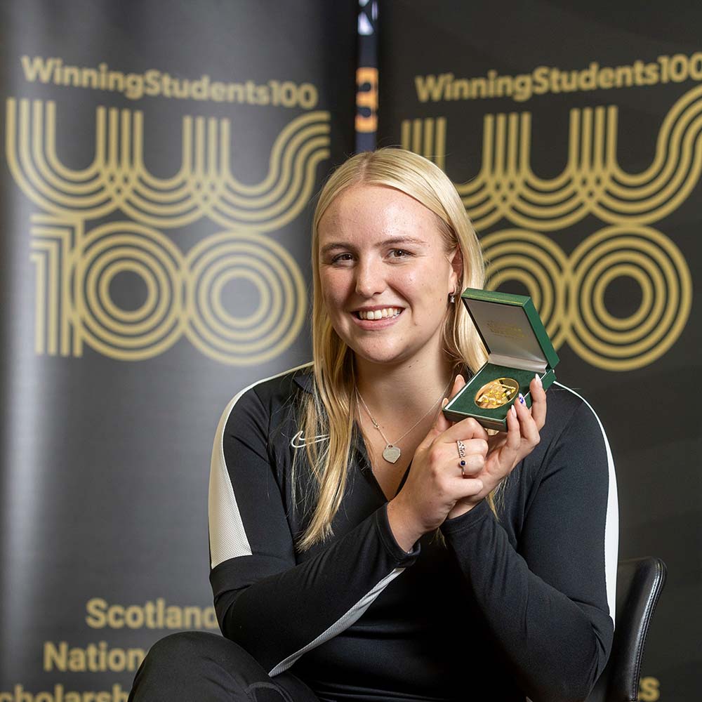 Faye Rogers with the inaugural André Reibig Medal.